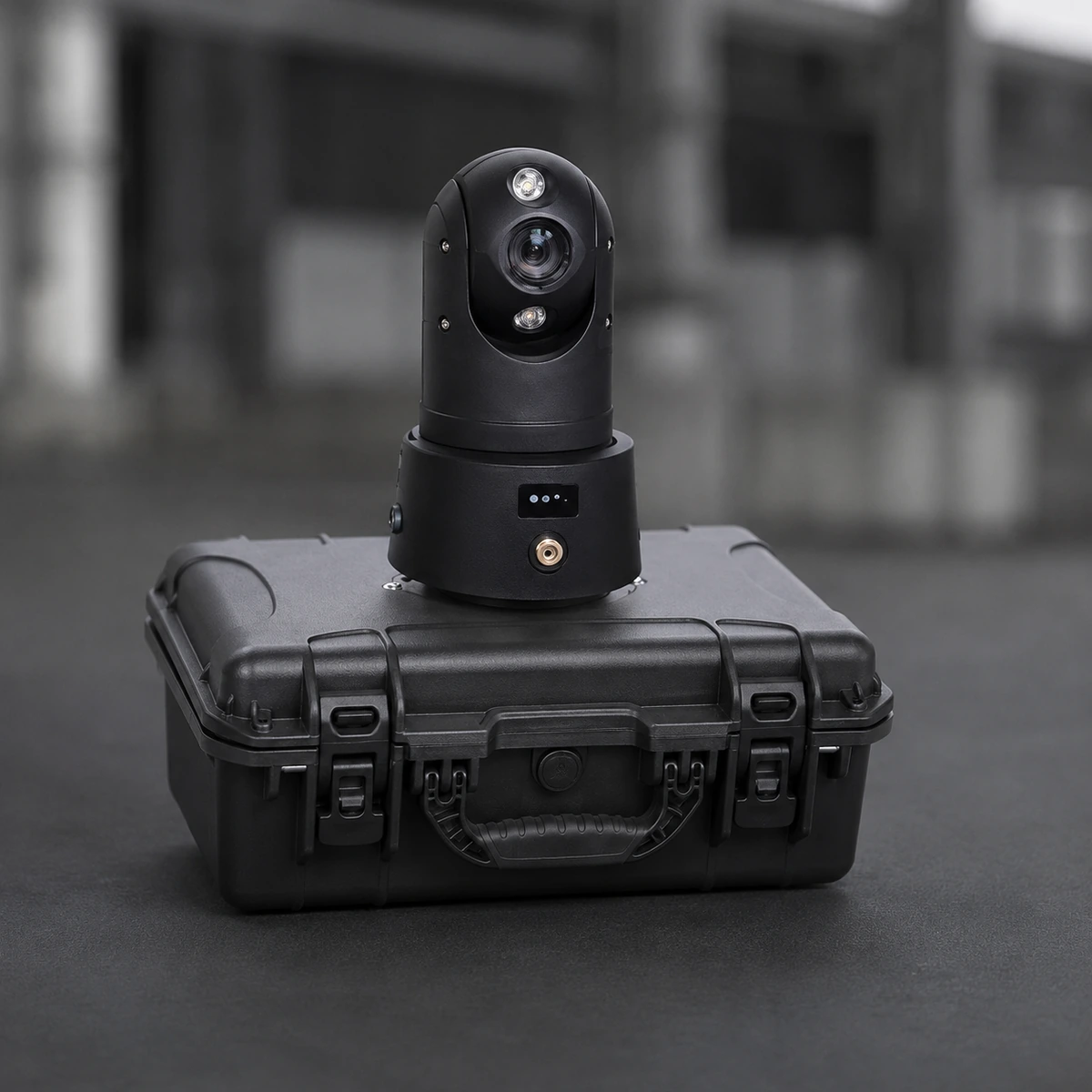Portable battery powered 4G PTZ camera on a telescopic tripod beside a vehicle