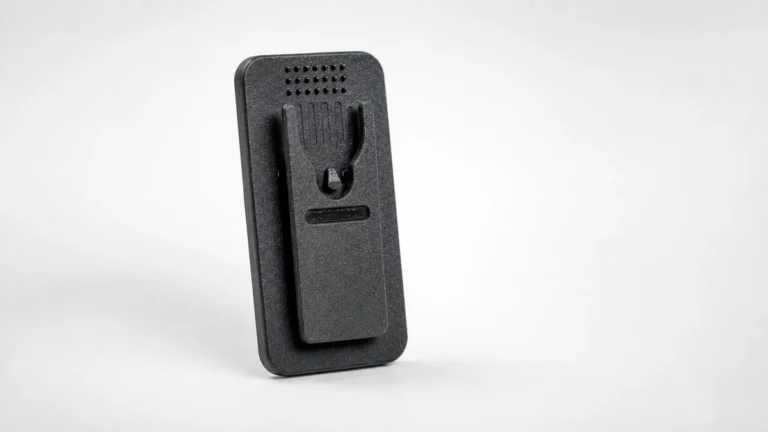 Body camera belt clip showing the sprung retaining clip on the back plate