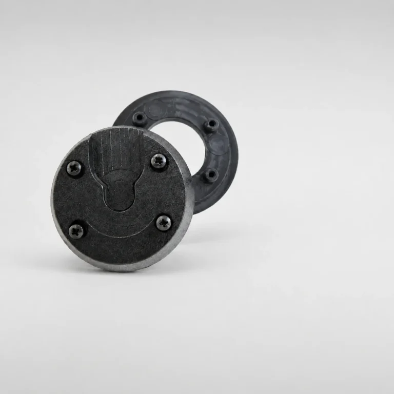Magnetic body camera mount, showing the magnet and the backing plate