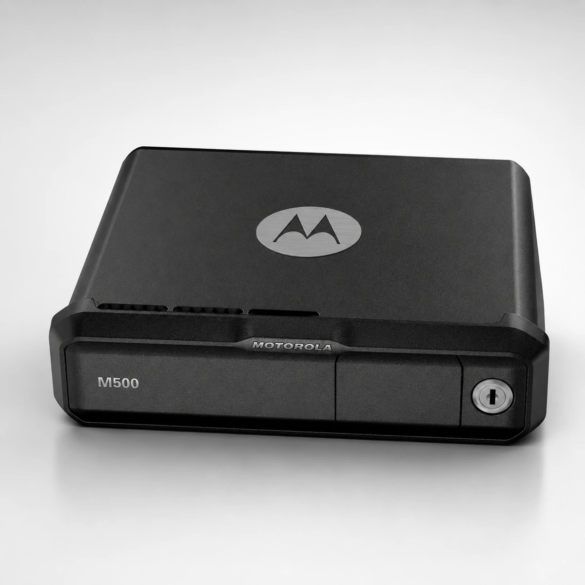 Motorola M500 core processor, a single DIN unit with the Motorola logo on the lid, ventilation slots and a keyed lock on the removable storage bay