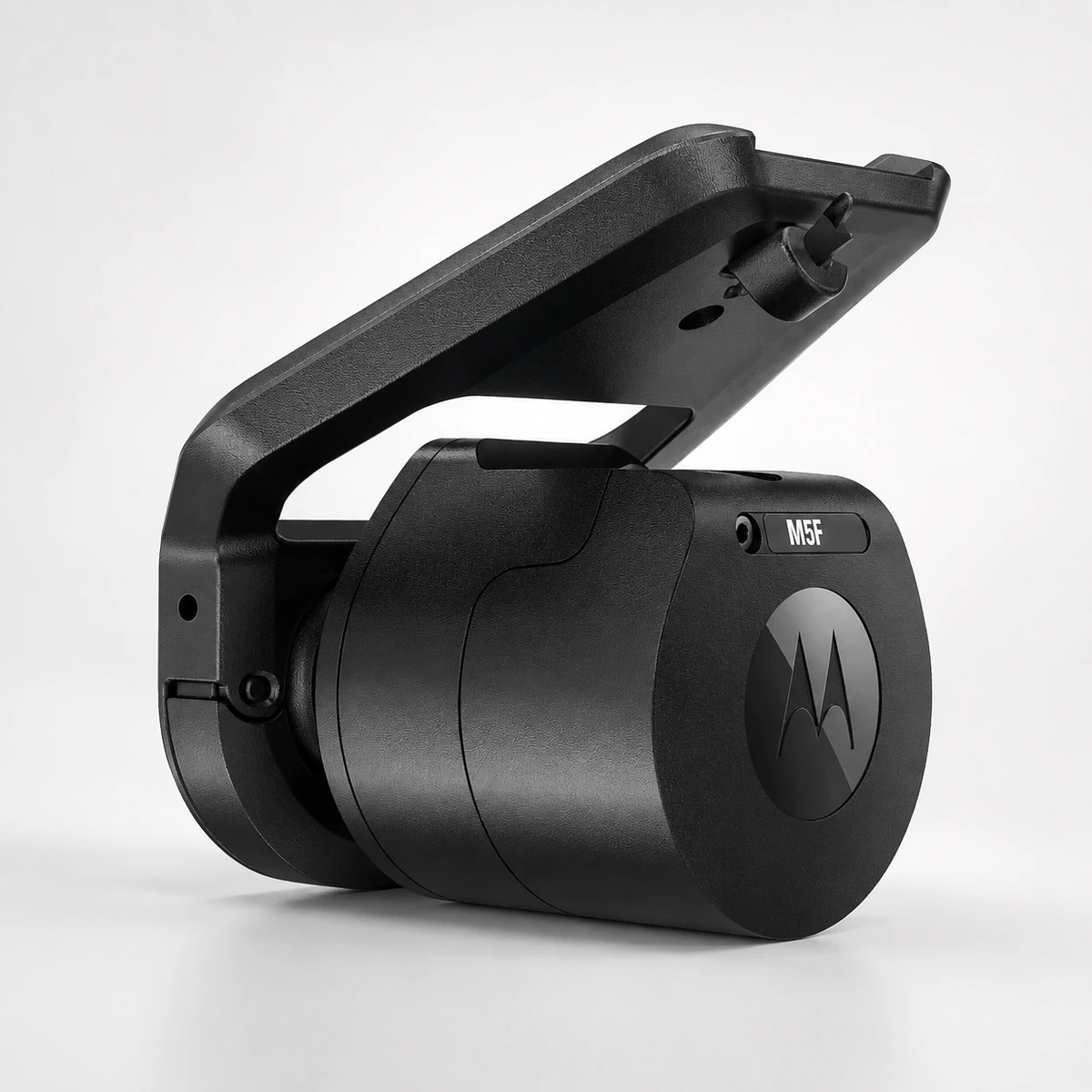 Motorola M5F front camera on its windscreen mount bracket, showing the cylindrical body, the model label and the pivot that sets the angle