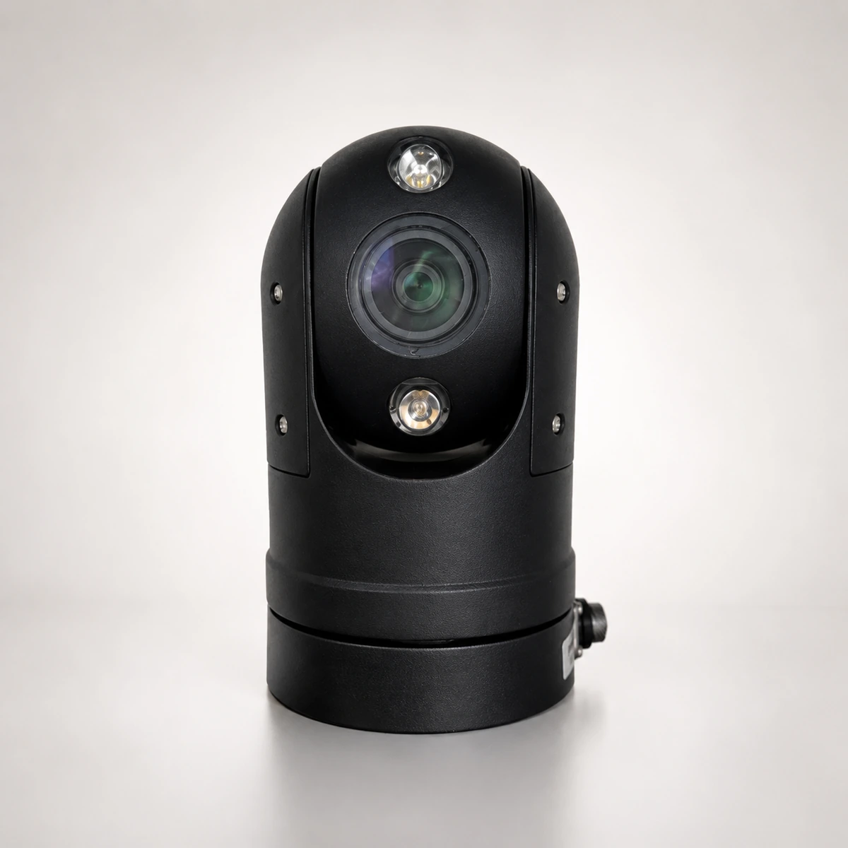 Xignal C814 vehicle PTZ camera, a compact dome head in black showing the zoom lens between two infrared lamps, on its cylindrical rotating base