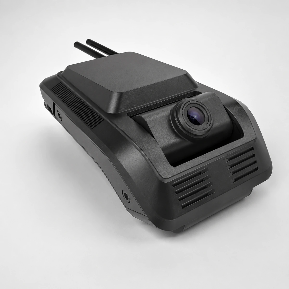 Xignal M606 dash camera, three quarter view showing the cabin facing lens, the two antenna stubs, the ventilation louvres and the side ports